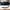 Front Bumper Lip Spoiler – Gloss Black / Carbon Look (F10/F11 2010–2016 M Sport)